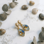 Blue floral resin drop earrings with gold plating