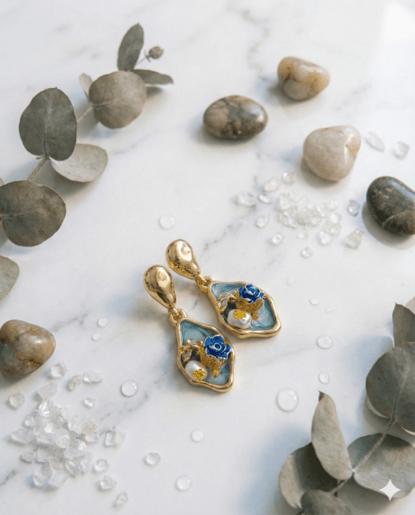 Blue floral resin drop earrings with gold plating
