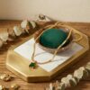 Gold plated emerald green stone pendant necklace with snake chain for women