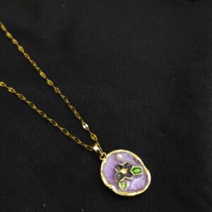 Lavender enamel floral pendant necklace with gold plated chain on black background